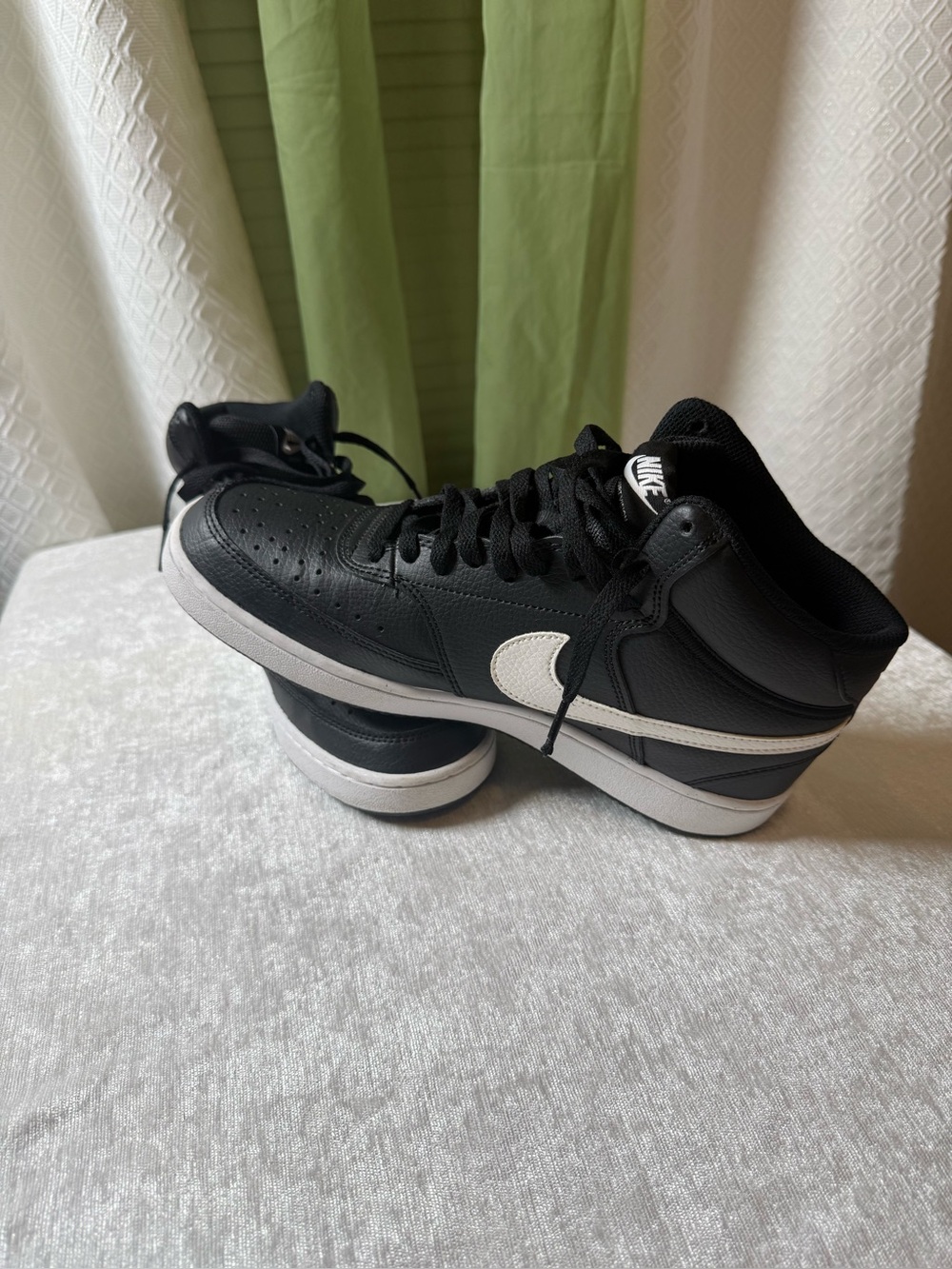 Nike Women’s Black and White High-Top Sneakers